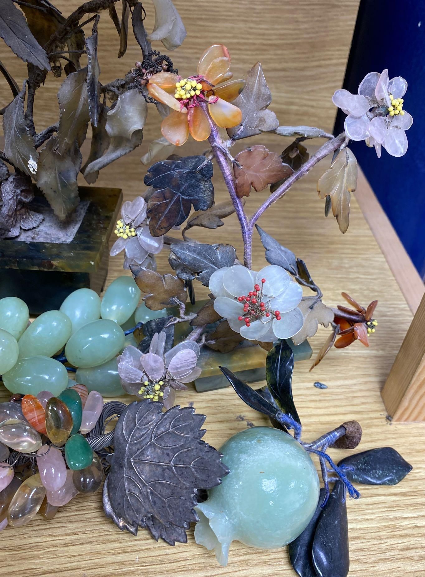 A group of hardstone grapes and floral displays and jadeite carvings